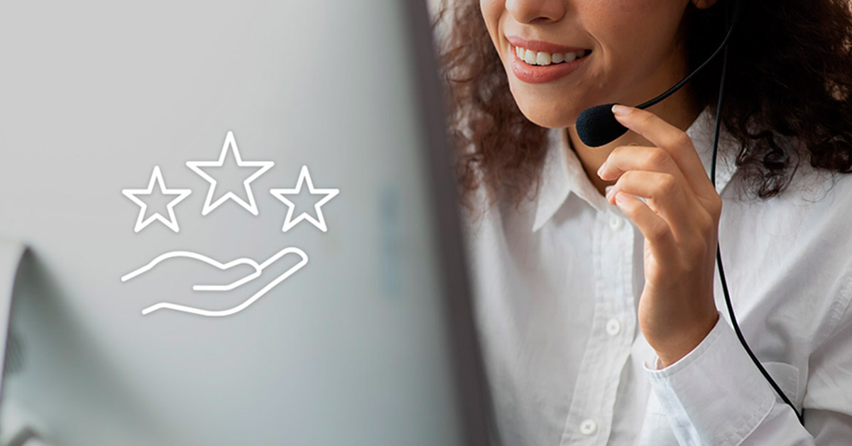 Person smiling at computer with hand giving stars showing the value of repeat customers from the The Gift of Customer Loyalty article by Design At Work
