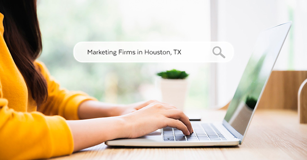 Woman searching for marketing firms in Houston on her laptop showing SEO in action from the Content Marketing: How SEO Helps Build Your Brand article by Design At Work