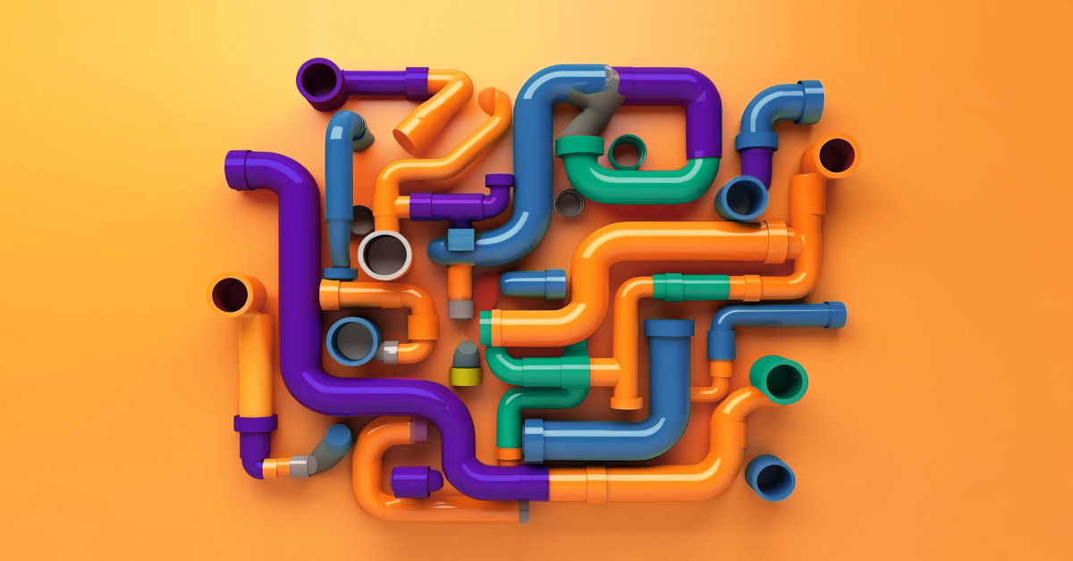 Multicolored pipes on orange background showing the many paths of planning a social media strategy from the How to Plan Your Social Media Strategy article by Design At Work