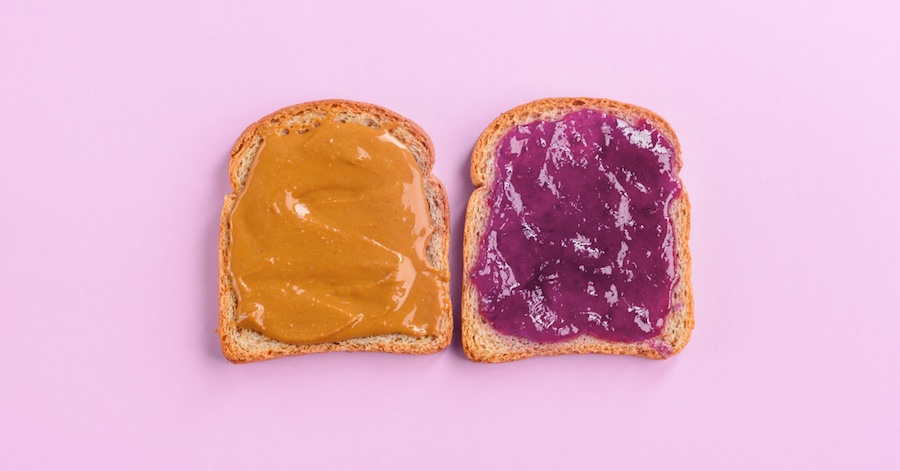 Two bread slices with peanut butter and jelly showing how sales and marketing align from the Better Together: How to Align Your Sales and Marketing Teams article by Design At Work