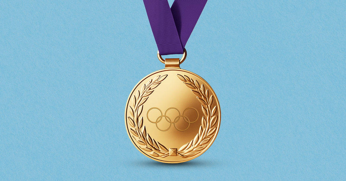 Olympic gold medal on purple ribbon with blue background showing success of the Five-Ring Marketing Strategy from the Go for the Gold with This Five-Ring Marketing Strategy article by Design At Work