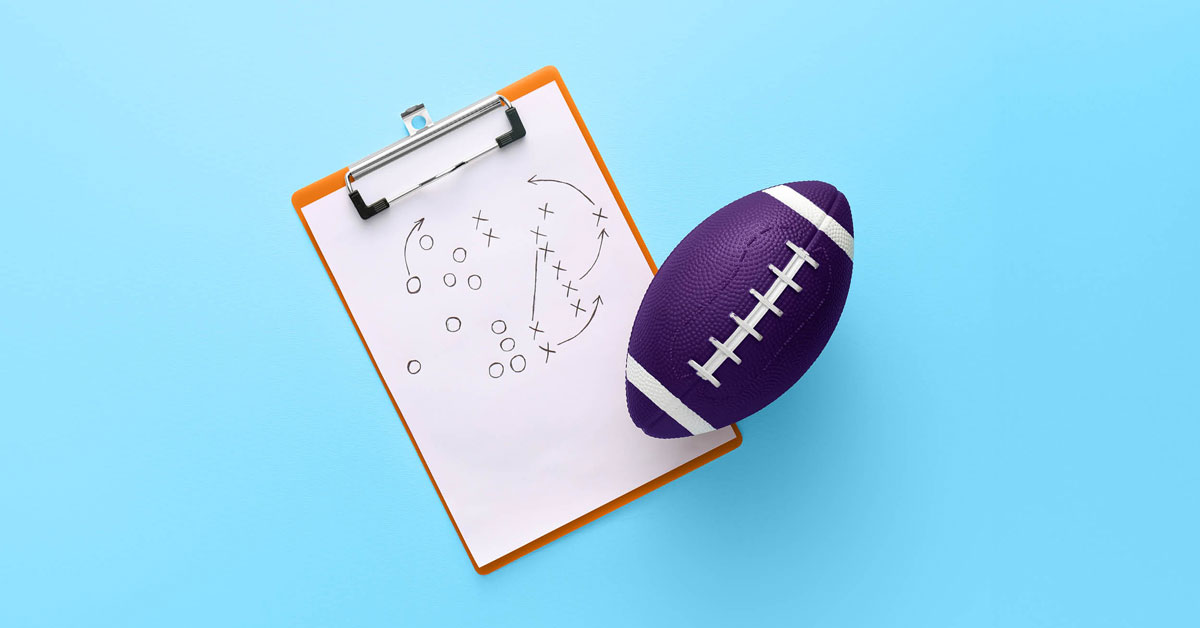 Football and coach's clipboard showing strategy from the How to Reach Your Audience (Without a Super Bowl Budget) article by Design At Work